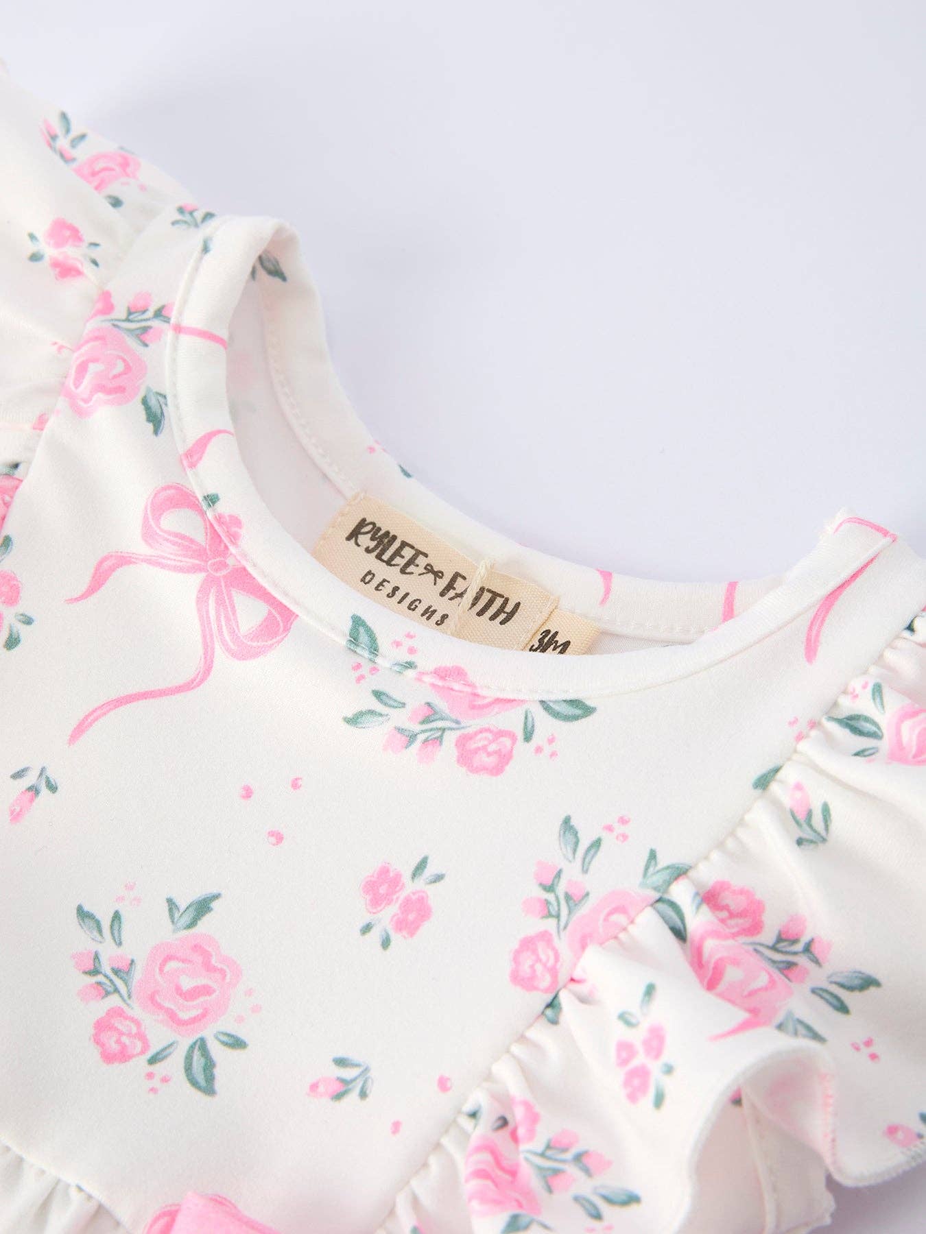 Floral Baby Girls Bow Ruffle Romper - Premium Baby & Toddler Outfits from Rylee Faith Designs - Just $26.95! Shop now at Pat's Monograms