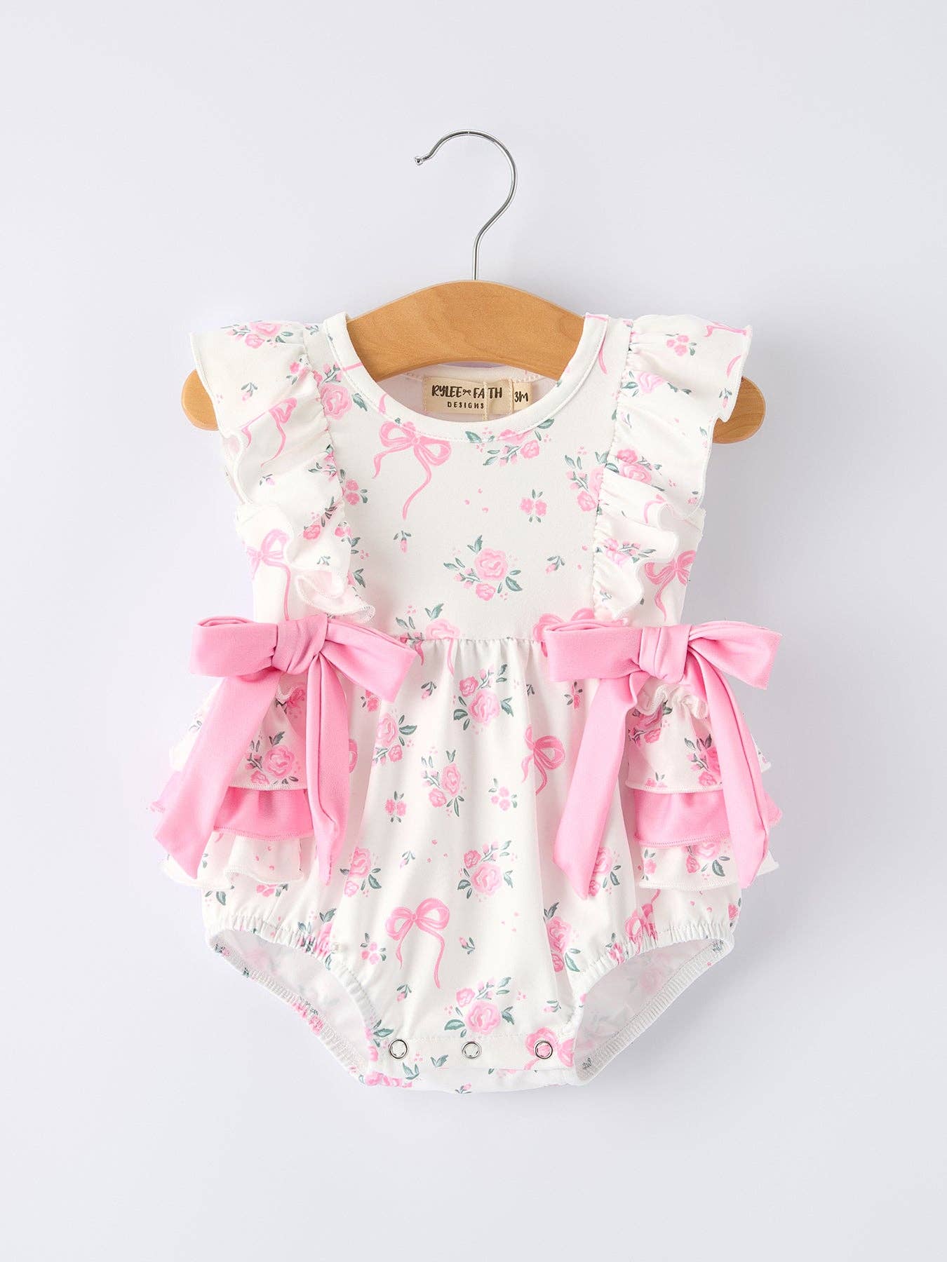 Floral Baby Girls Bow Ruffle Romper - Premium Baby & Toddler Outfits from Rylee Faith Designs - Just $26.95! Shop now at Pat's Monograms