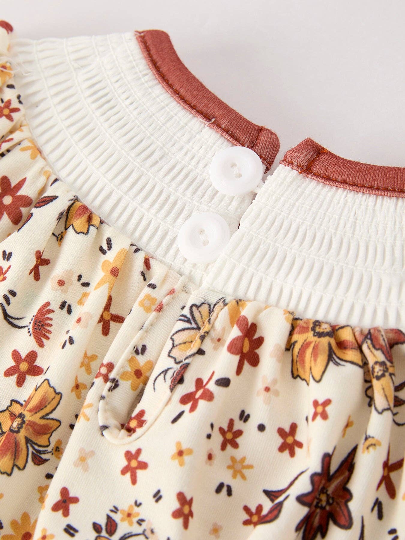 Colorful Floral Smocked Cross Baby Girl Romper - Premium  from Rylee Faith Designs - Just $24.95! Shop now at Pat's Monograms