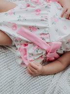 Floral Baby Girls Bow Ruffle Romper - Premium Baby & Toddler Outfits from Rylee Faith Designs - Just $26.95! Shop now at Pat's Monograms
