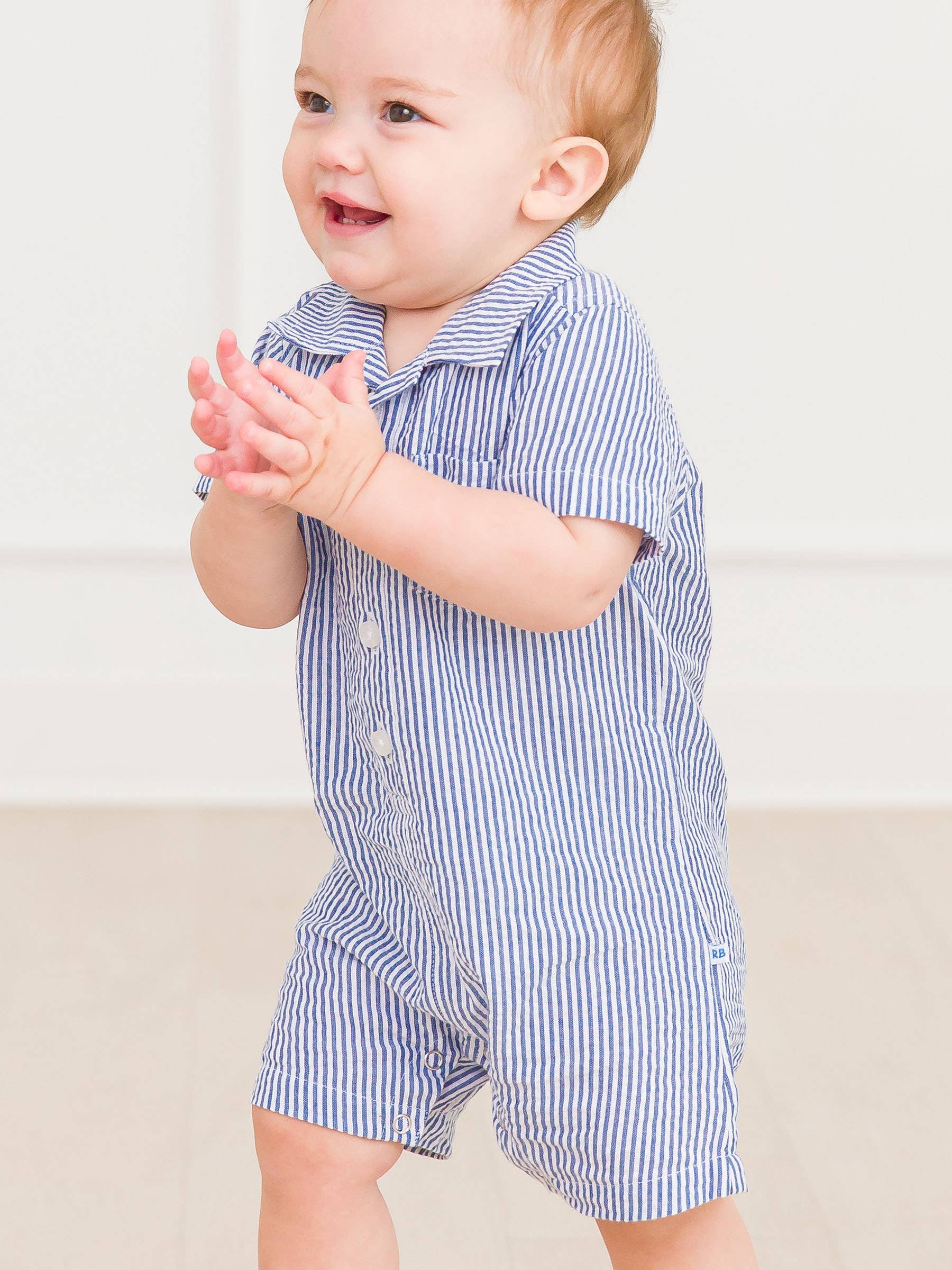 Baby Boys Blue Seersucker Button-Up Romper - Premium Baby & Toddler Outfits from RuffleButts + RuggedButts - Just $42.95! Shop now at Pat's Monograms