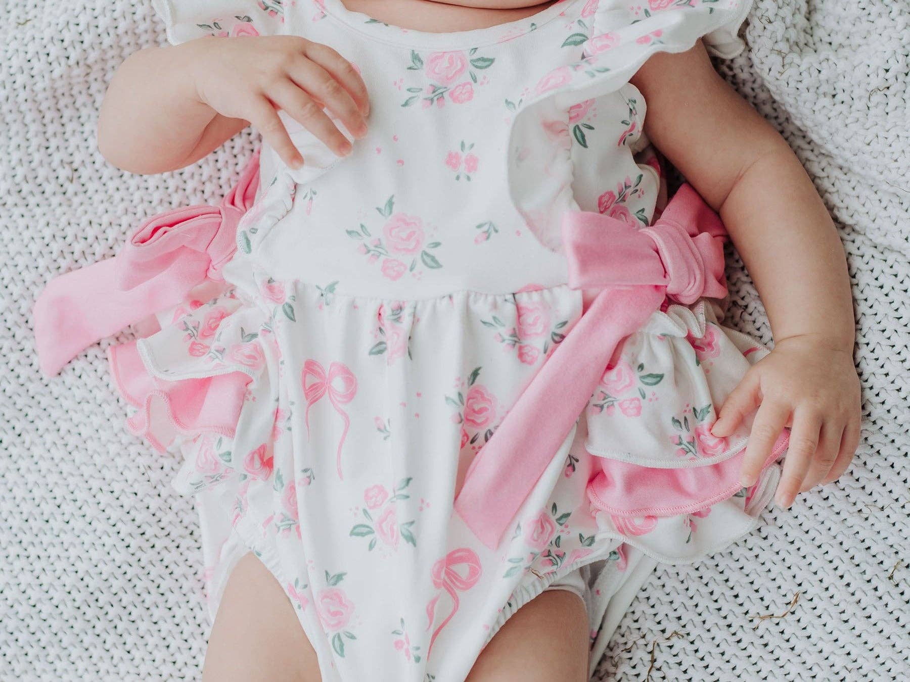 Floral Baby Girls Bow Ruffle Romper - Premium Baby & Toddler Outfits from Rylee Faith Designs - Just $26.95! Shop now at Pat's Monograms