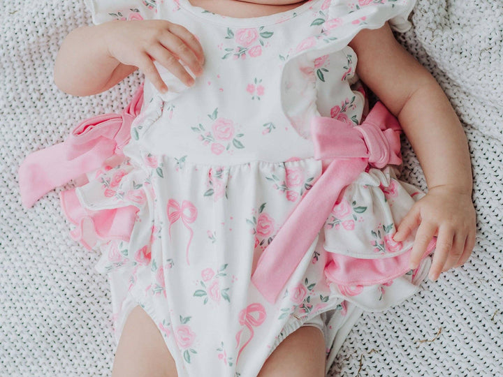 Floral Baby Girls Bow Ruffle Romper - Premium Baby & Toddler Outfits from Rylee Faith Designs - Just $26.95! Shop now at Pat's Monograms