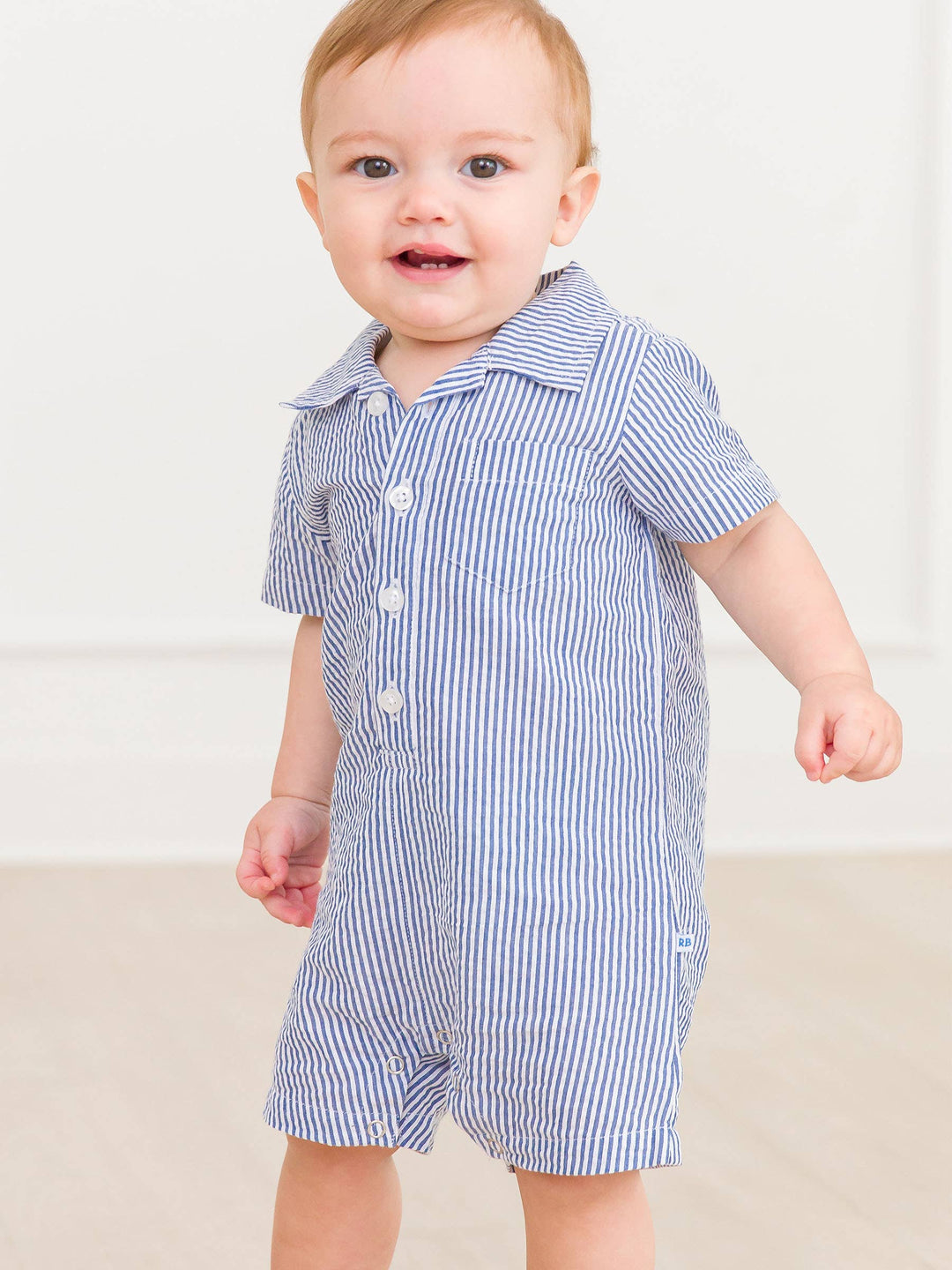 Baby Boys Blue Seersucker Button-Up Romper - Premium Baby & Toddler Outfits from RuffleButts + RuggedButts - Just $42.95! Shop now at Pat's Monograms