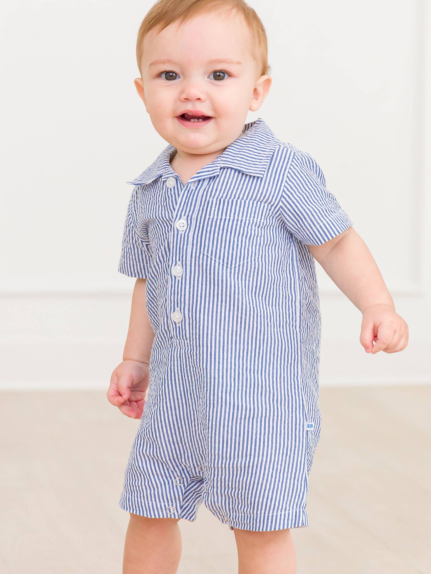 Baby Boys Blue Seersucker Button-Up Romper - Premium Baby & Toddler Outfits from RuffleButts + RuggedButts - Just $42.95! Shop now at Pat's Monograms