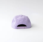 A light purple baseball cap viewed from the back, centered against a clean white studio background.