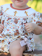 Colorful Floral Smocked Cross Baby Girl Romper - Premium  from Rylee Faith Designs - Just $24.95! Shop now at Pat's Monograms