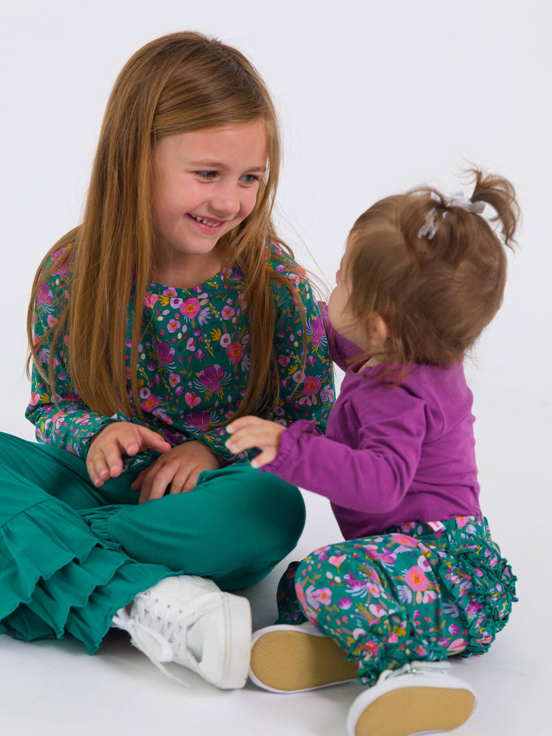Baby Girls Plum Tart Knit Long Sleeve Ruffle Bodysuit - Premium Baby & Toddler Outfits from RuffleButts + RuggedButts - Just $24.95! Shop now at Pat's Monograms