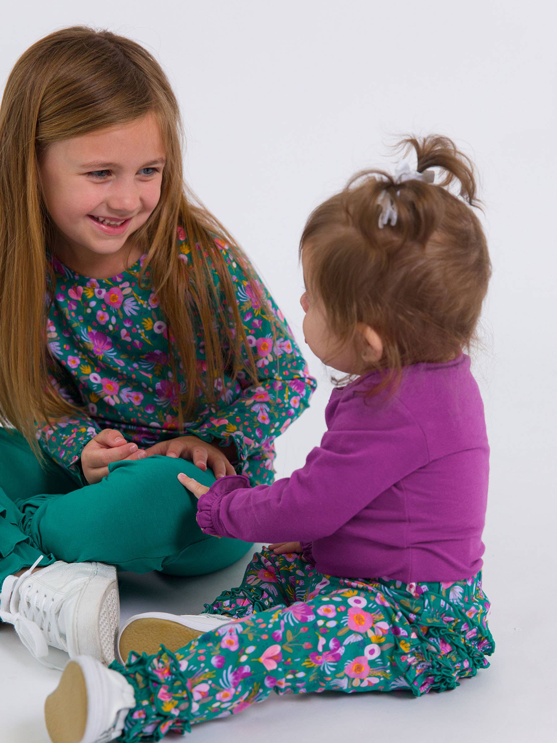Baby Girls Plum Tart Knit Long Sleeve Ruffle Bodysuit - Premium Baby & Toddler Outfits from RuffleButts + RuggedButts - Just $24.95! Shop now at Pat's Monograms